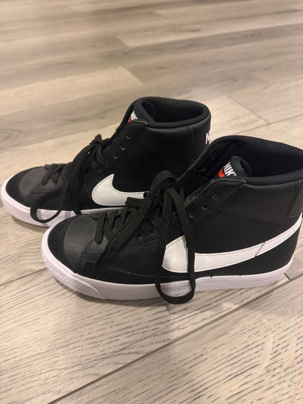 Nike Black and White High-Top Sneakers with Swoosh